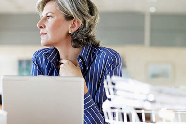 Woman looking concerned at work.
