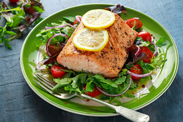 Healthy meal with vegetables and salmon.