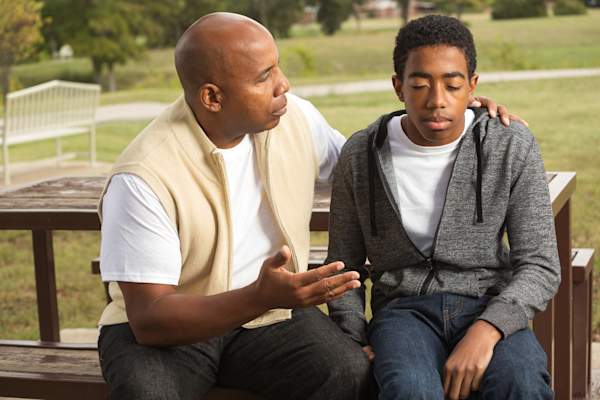 Father and son talking about depression.