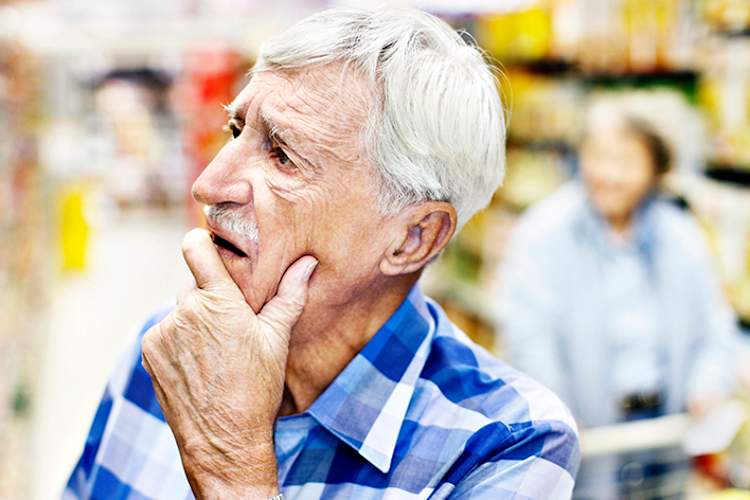 Confused senior in a grocery store.