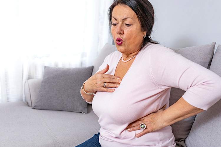 Woman having a heart attack.