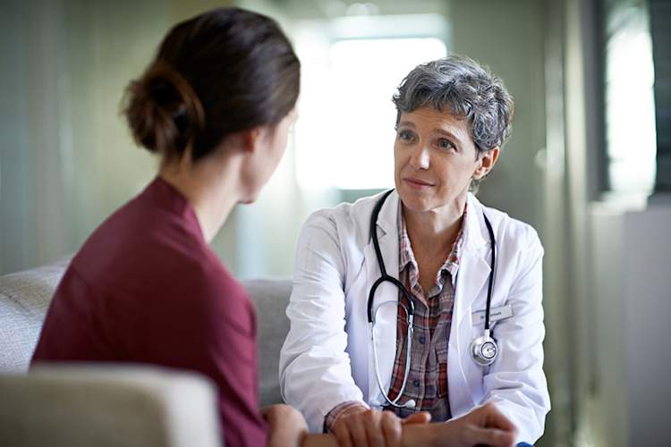Doctor comforting a patient.