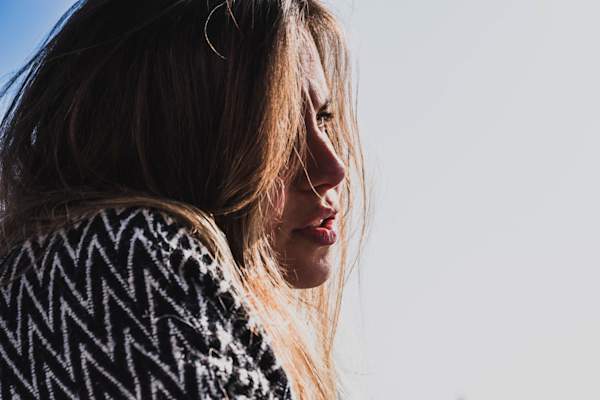 woman talking, looking confused