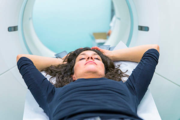 Woman getting an MRI scan.