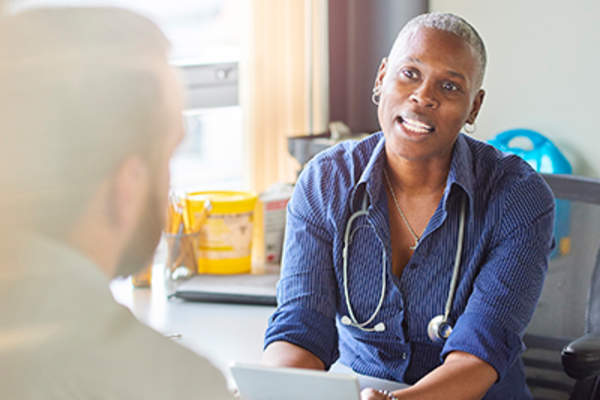 Doctor explaining something to a patient.