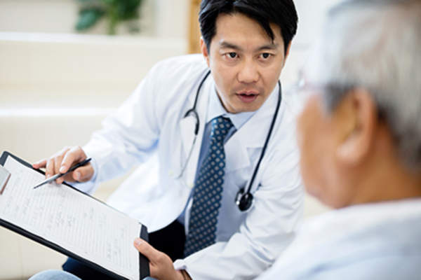Doctor explaining treatments for hormonally refractory prostate cancer.