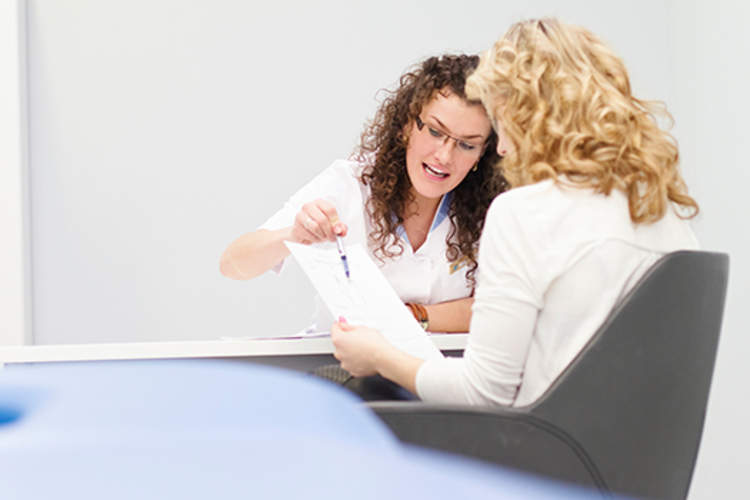 Oncologist working with patient to make her comfortable with what's ahead.