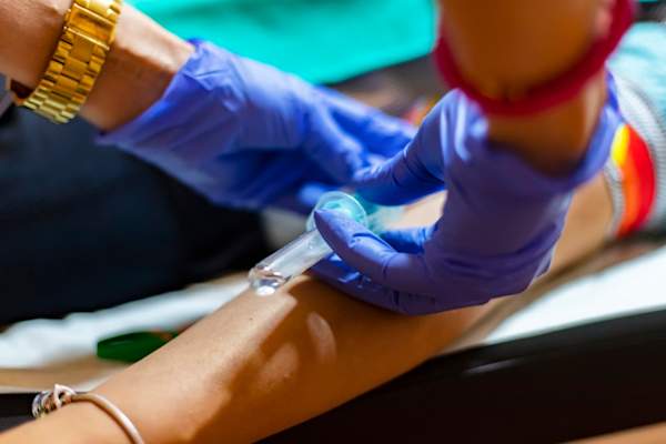 Nurse taking blood sample