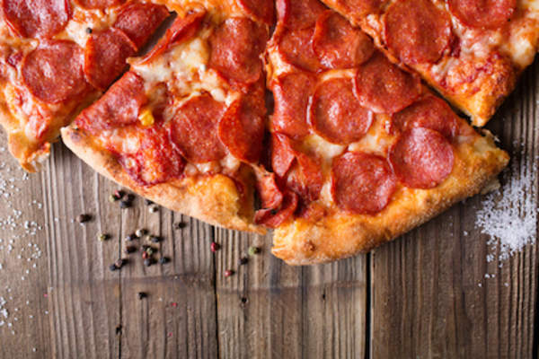 Pepperoni pizza on table.