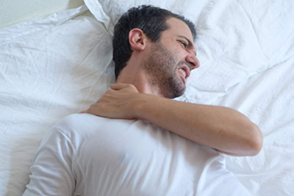 Man with morning neck muscle stiffness.