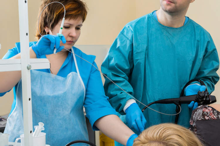 Woman having a bronchoscopy.