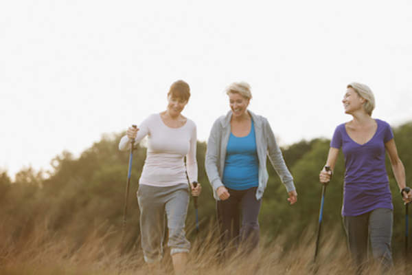 Three older caucasian women hiking.