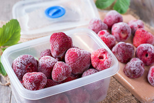 Frozen strawberries in a container