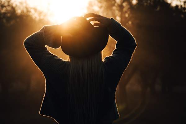woman in cowboy hat from behind