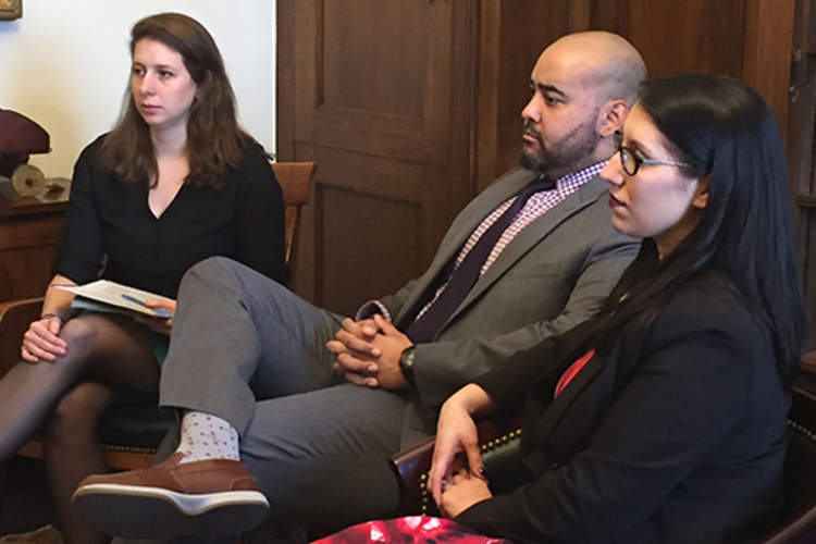 Aaron and Stefanie in a congressional office, with staffer, during Headache on the Hill.