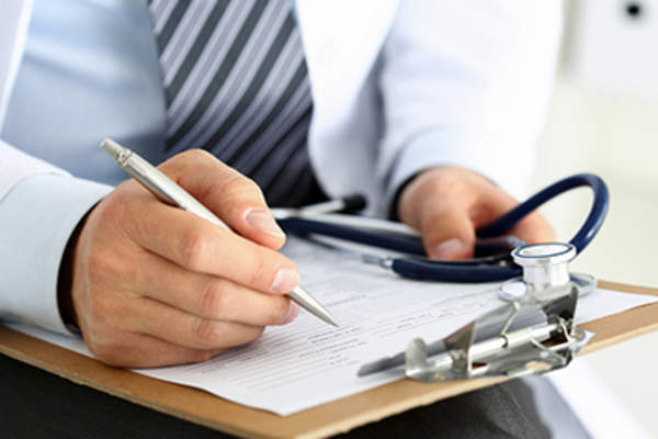Asthma specialist holding clipboard.