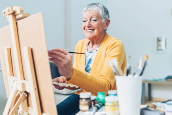 Woman painting with joy.
