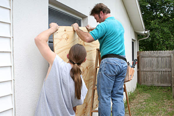 Family preparing for a hurricane.