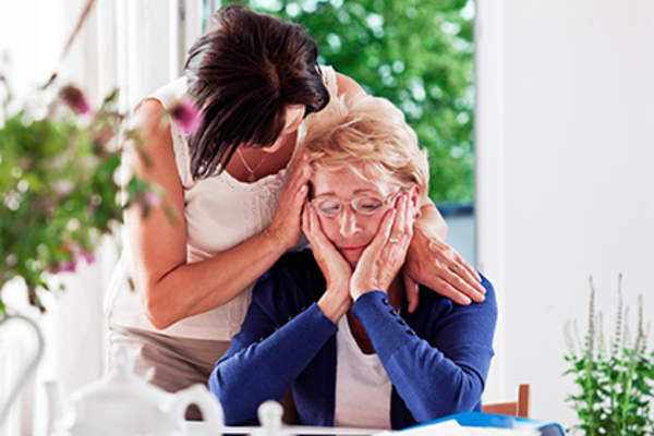Woman consoling her friend.