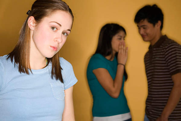 couple making fun of teen girl image