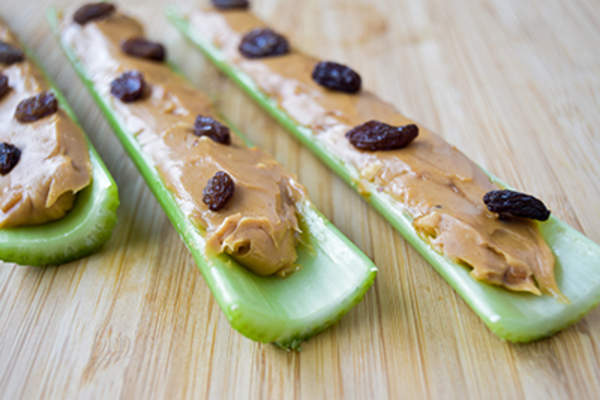 Raisins and peanut butter on celery, ants on a log snack.