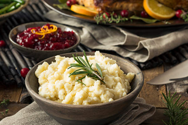 Mashed potatoes on a Thanksgiving table.