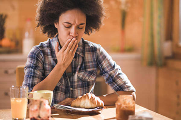 Woman with loss of appetite can't eat breakfast.