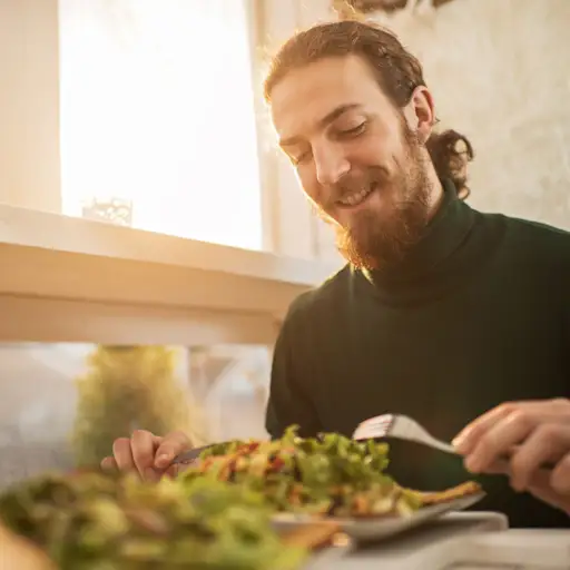Young happy man enjoying a healthy meal.
