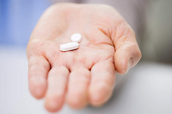 Hand with pills.