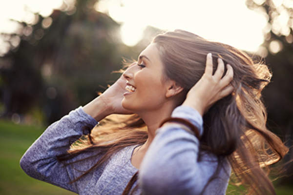 Woman flipping her hair around.
