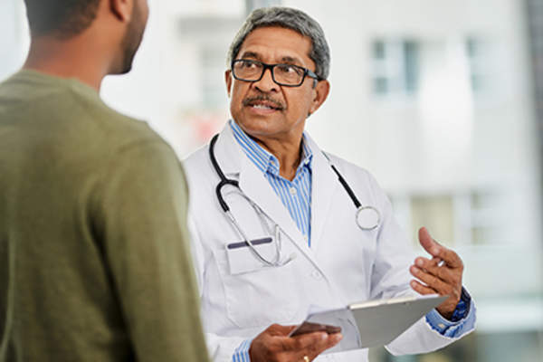 Patient consulting his doctor.