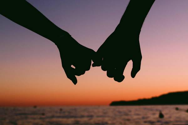 pinkies linked holding hands