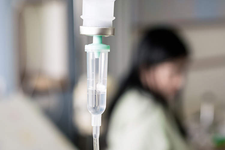 Patient getting an infusion at the hospital.