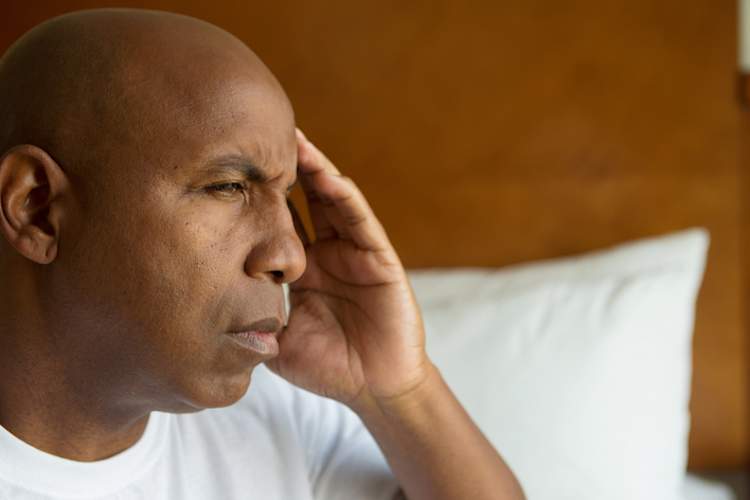 Man with migraine.