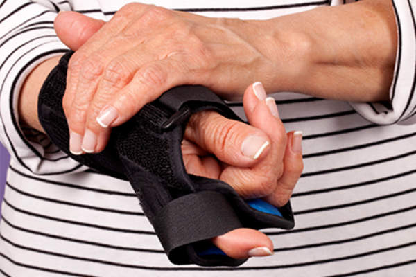 Woman with hand in resting splint.
