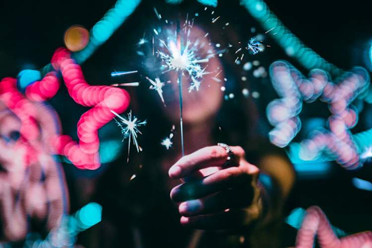 woman holding sparkler