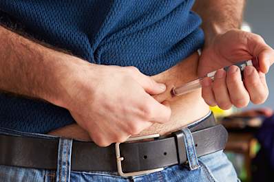 Man injecting insulin.