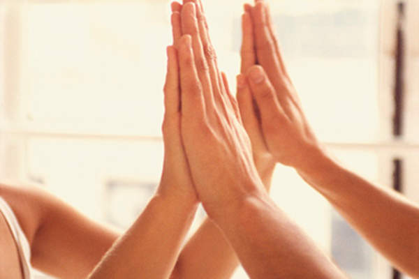 Hands touching together.