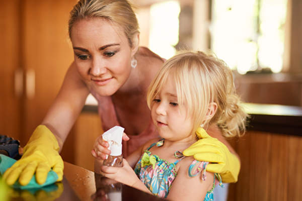 woman and young daughter spring cleaning