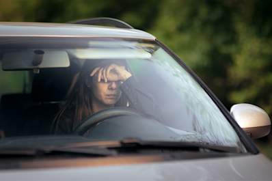 Stressed woman in a car.