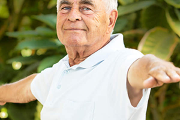 Senior man exercising outside image.