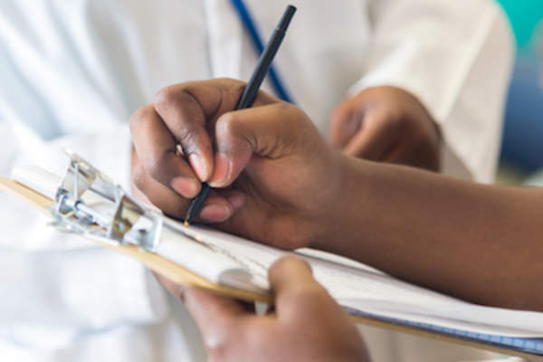 Patient signing a consent form