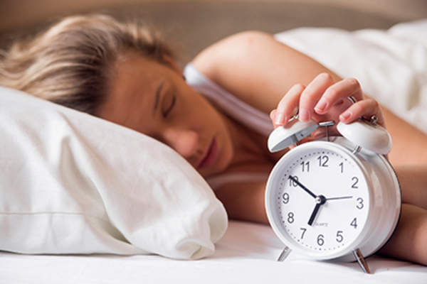 Woman using melatonin to sleep well.