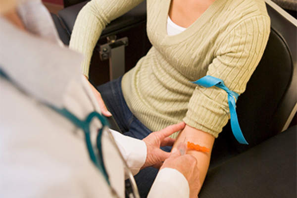Woman having blood test.