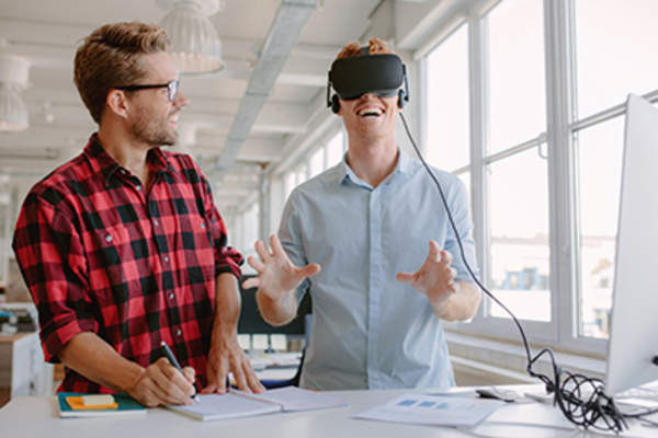 Young developers testing new virtual reality device.