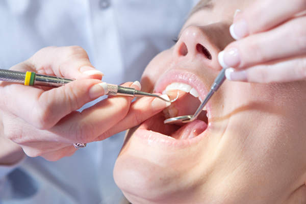 Woman having dental exam.