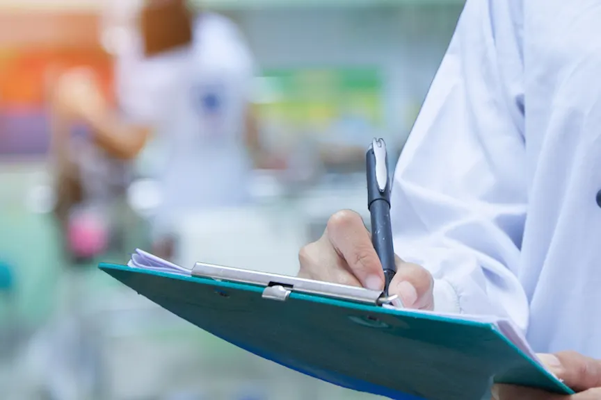 doctor writing prescription