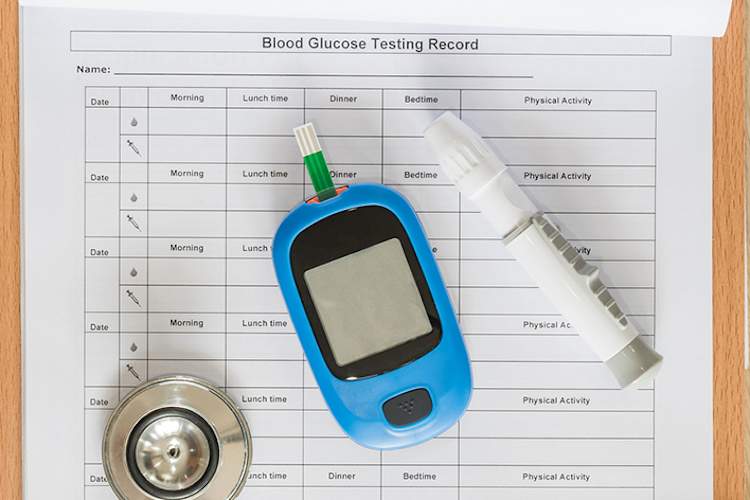Blood glucose record and diabetes supplies.