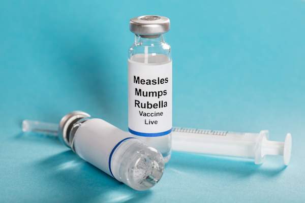 Vaccine concept vials and needle.