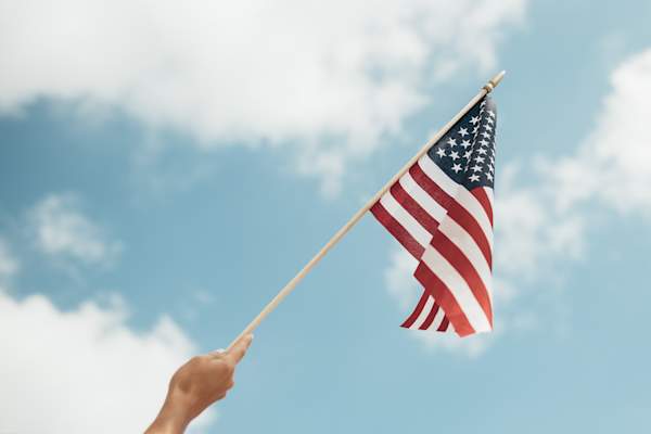 hand waving american flag